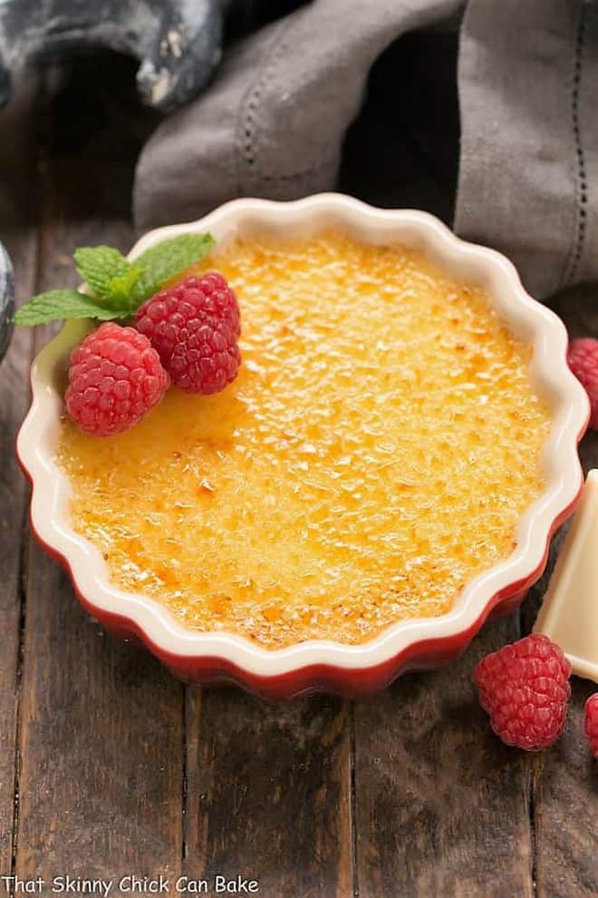 White Chocolate Crème Brûlée in a red ramekin.