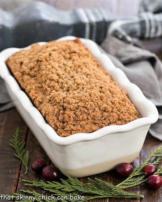 Streusel Topped Cranberry Bread in a white ceramic loaf pan