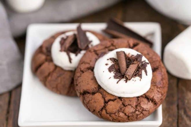 a square plate holding 2 marshmallow topped hot cocoa cookies