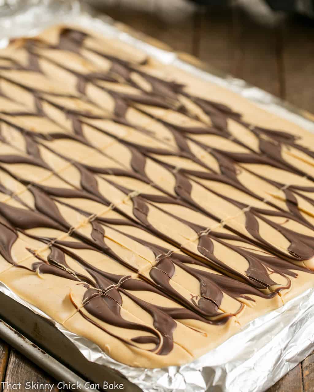 Peanut Butter Chocolate Tiger Bark on a foil lined sheet pan.