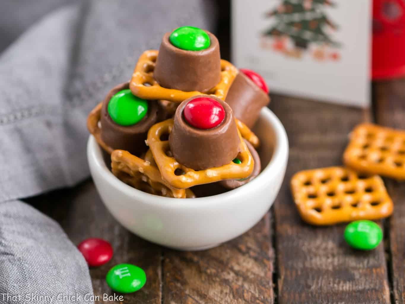 Easy Rolo Pretzel Bites in a white ceramic bowl ready for gifting.