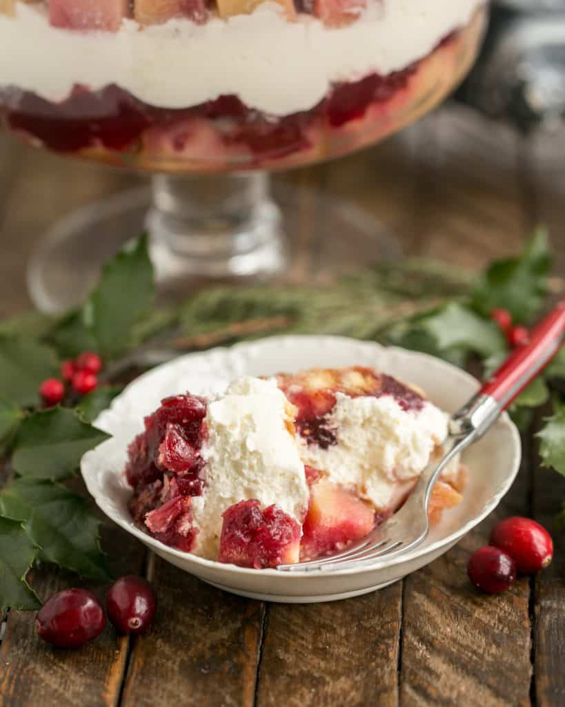 Cranberry Cheesecake Trifle in a white bowl with a fork