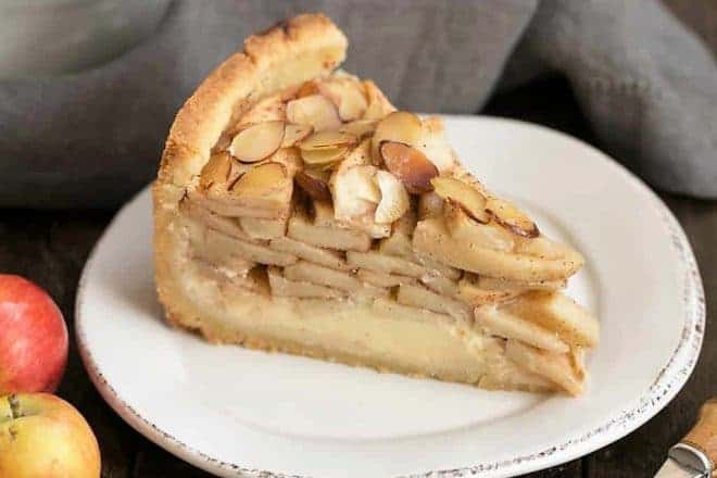 Cream Cheese Apple Torte on a round white dessert plate