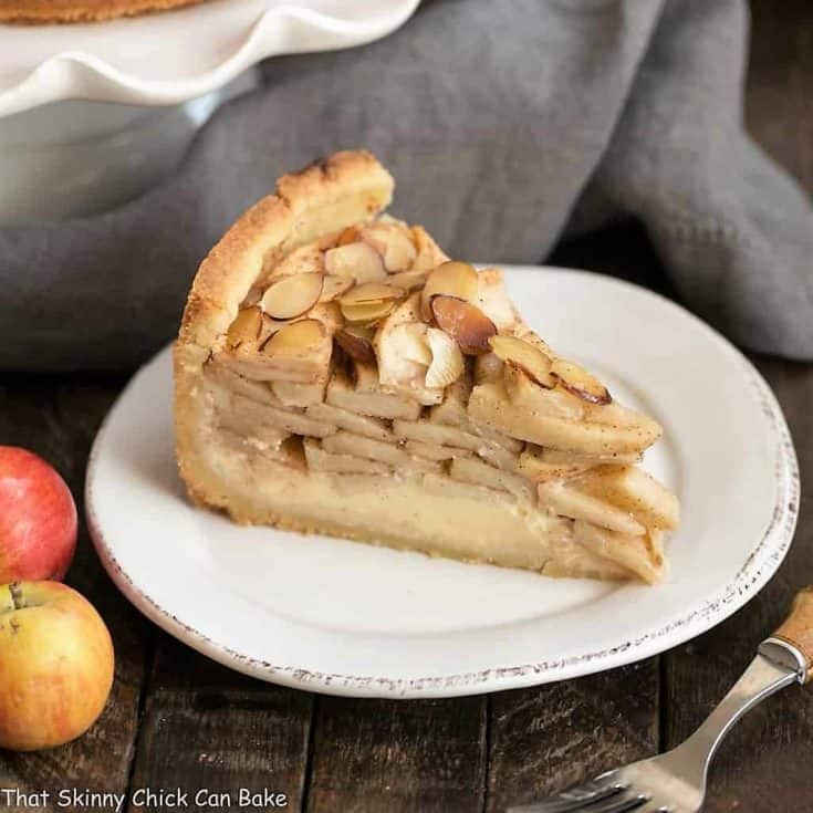 Cream Cheese Apple Torte on a round white dessert plate