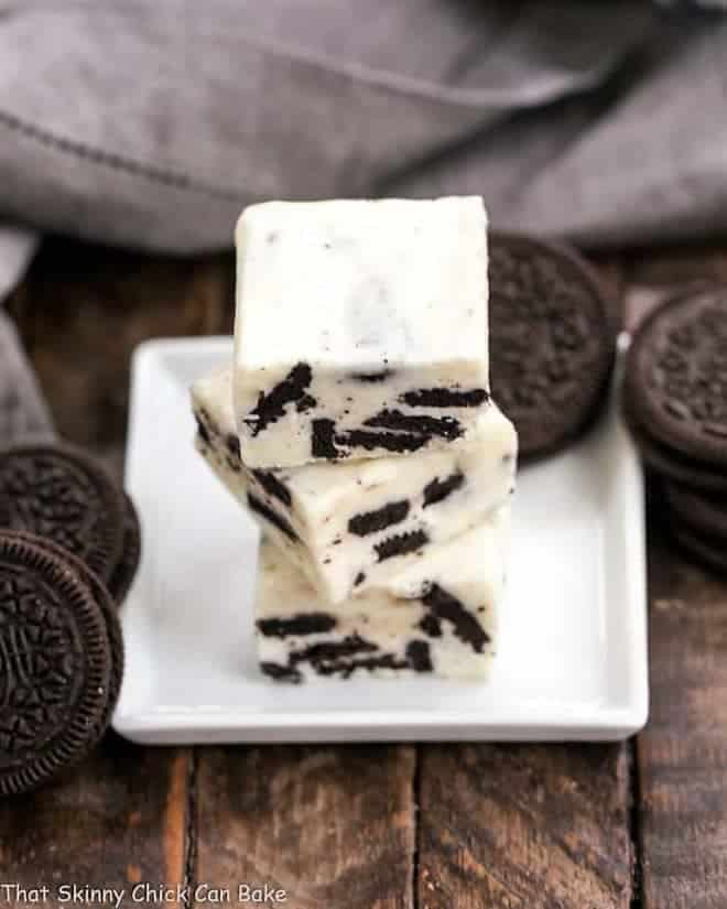 White Chocolate Oreo Fudge stacked on a white square plate