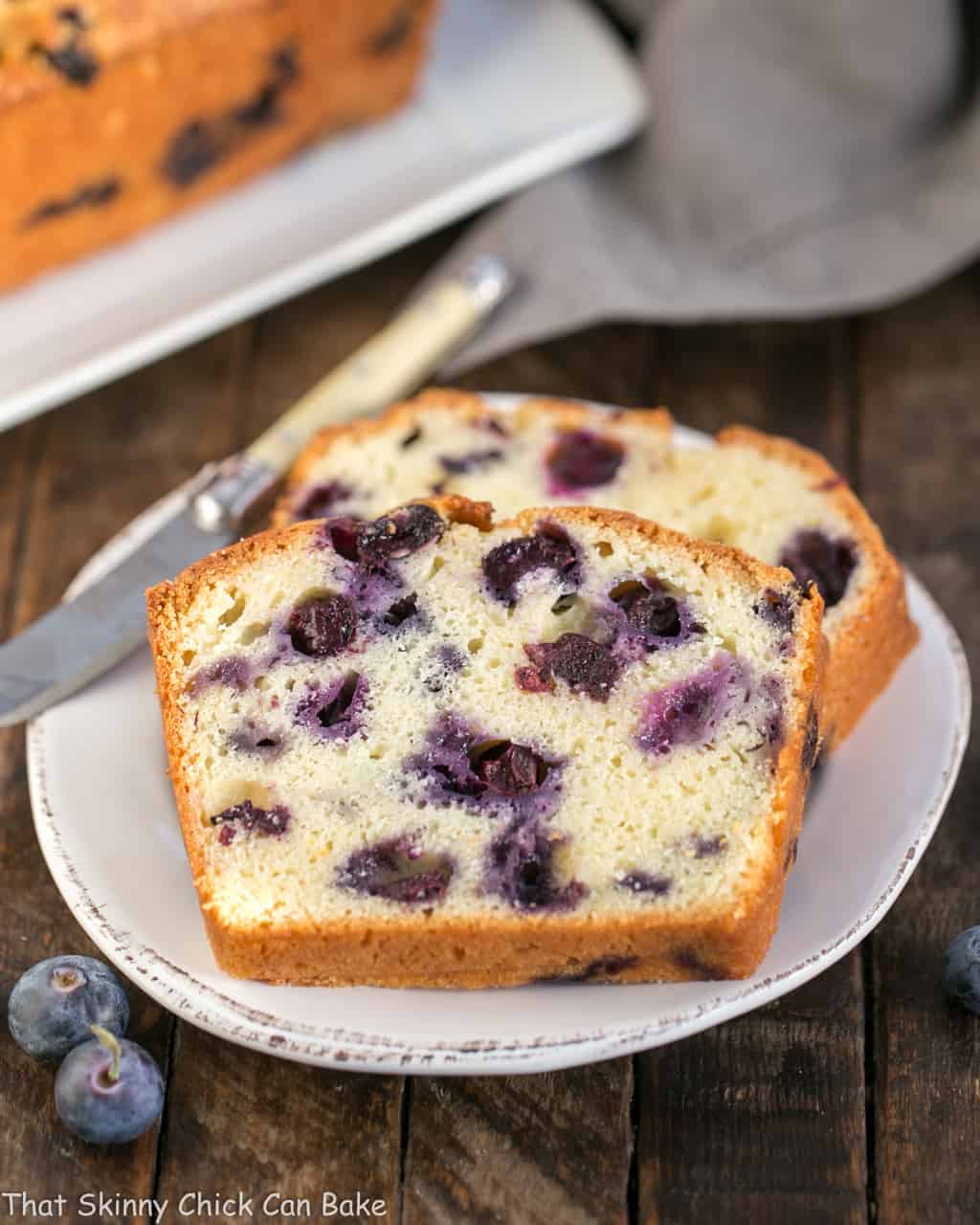 A piece of muffin bread on a white plate.