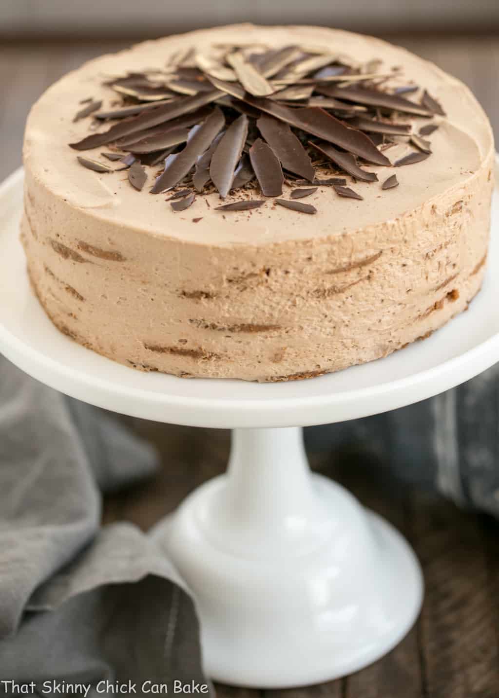 Mocha Chocolate Chip Cookie Icebox Cake on a white cake stand.