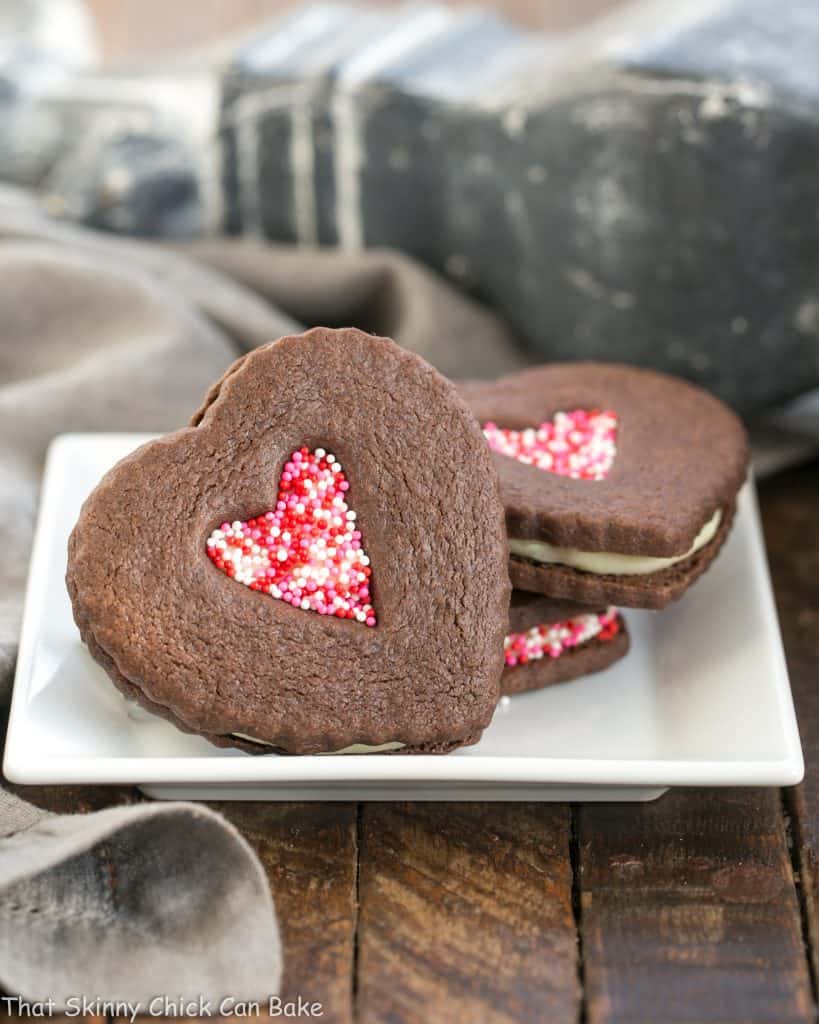 Chocolate Heart Sandwich Cookies on a square white plate