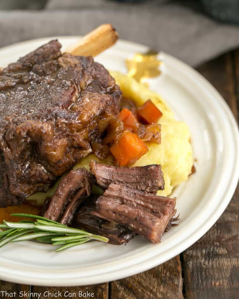Instant Pot Beef Short Ribs on a white plate with mashed potatoes