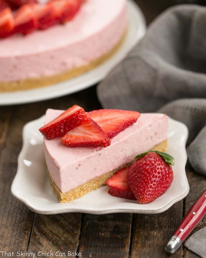 No-Bake Strawberry Cheesecake slice on a white dessert plate