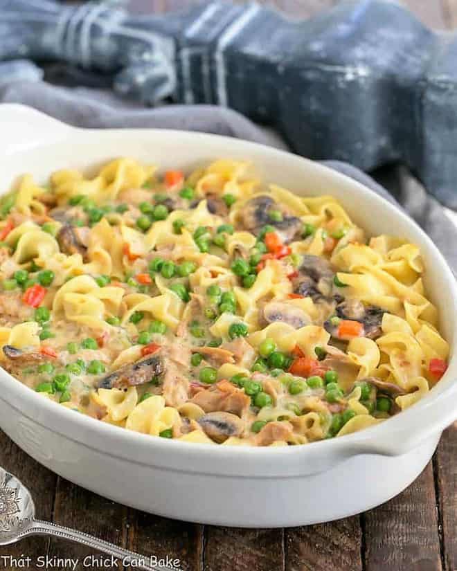 Tuna Noodle Casserole from Scratch - Tuna casserole without soup but instead a delicious creamy cheese sauce! Tuna Noodle Casserole from Scratch in a white ceramic casserole.
