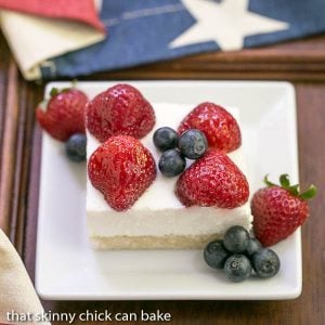 Berry Cheesecake Flag Dessert - Shortbread crust covered with a light whipped cheesecake filling, then decked out like the American flag with luscious, ripe berries!