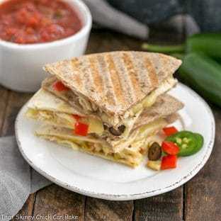 Chipotle Chicken Quesadillas stacked on a white plate
