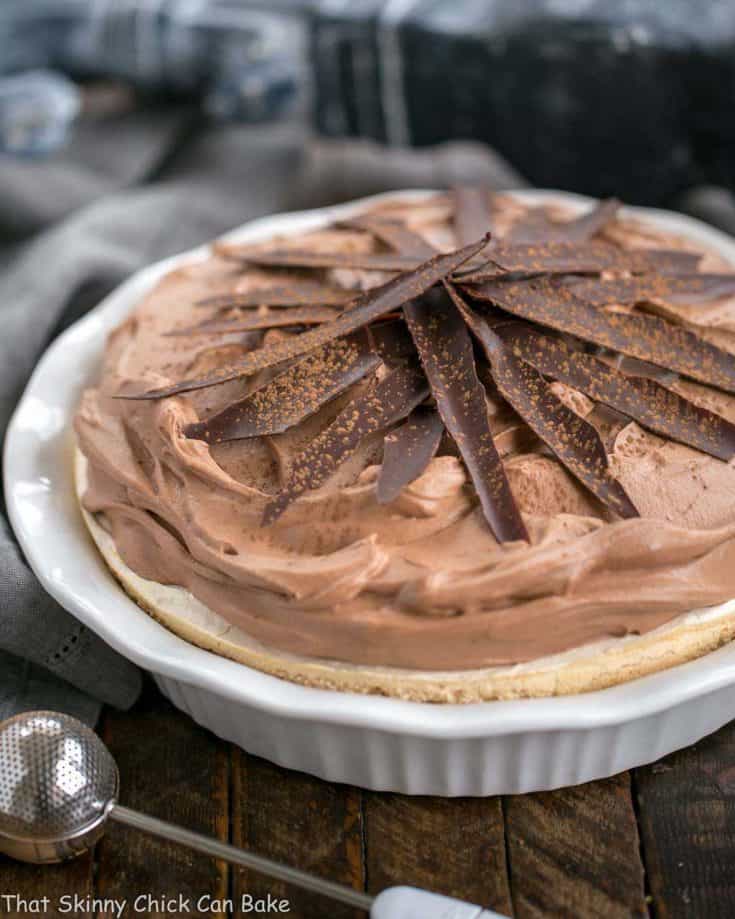 Chocolate Velvet Pie with Meringue Crust in white pie plate