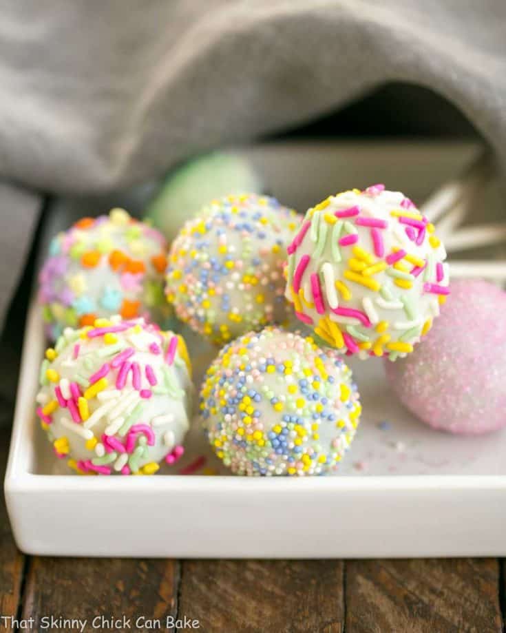 Easter Cake Pops resting on a square plate