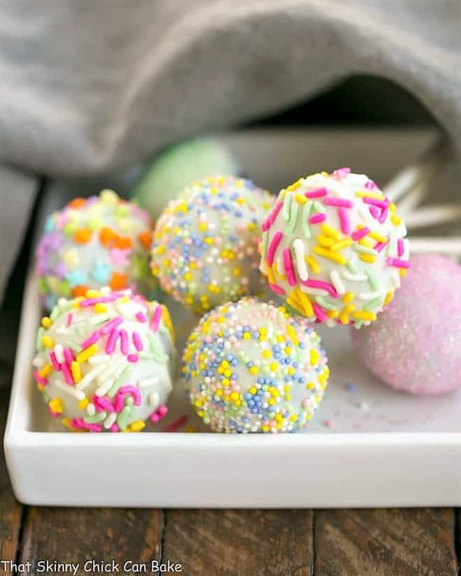 Easter Cake Pops - a festive holiday treat made with just four ingredients Easter Cake Pops resting on a square plate