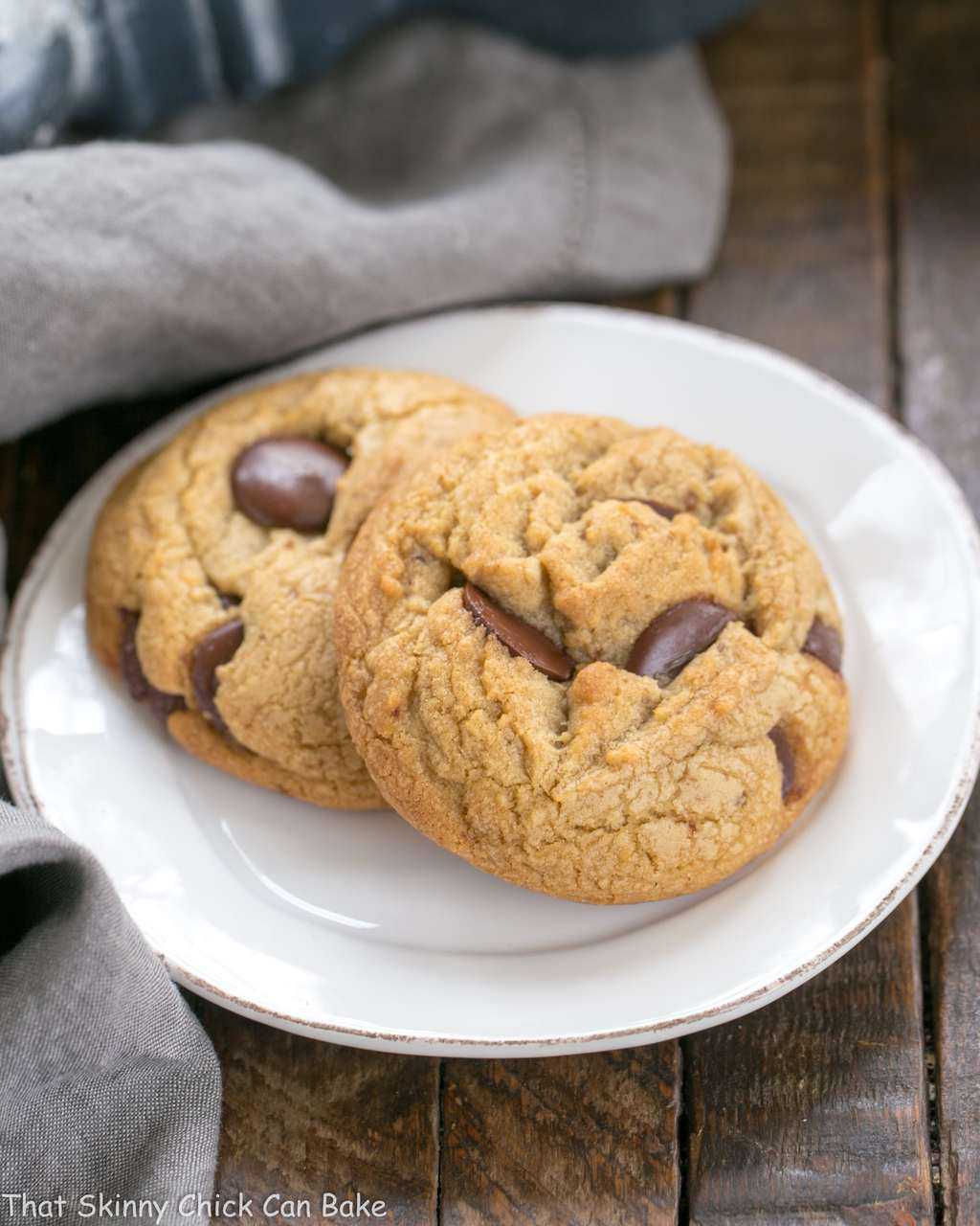 Brown Butter Chocolate Chip Cookies on a white dessert plate.