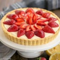 Strawberry Lemon Tart with lemon halves and whole strawberries