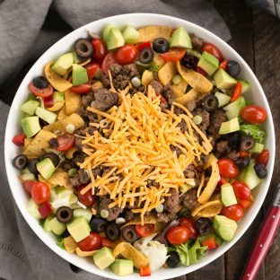 Beef Taco Salad with Salsa Dressing - a Tex-Mex salad with spicy ground beef, veggies, cheese and a creamy salsa dressing