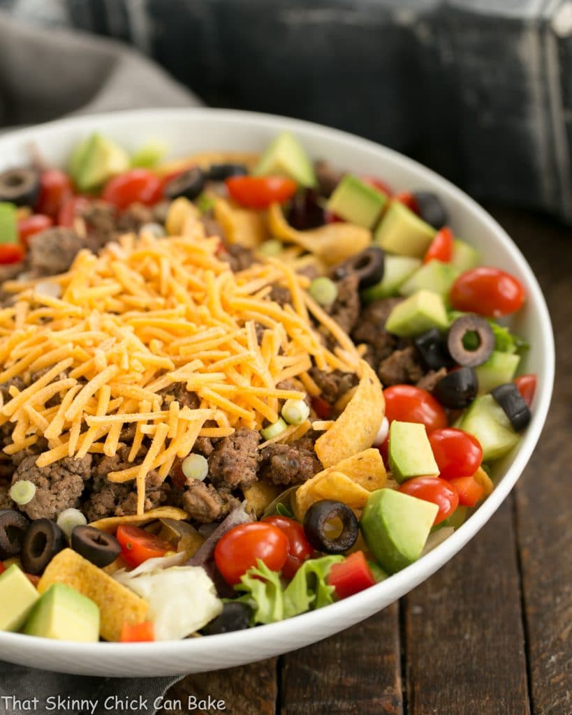 Beef Taco Salad with Salsa Dressing in a white ceramic bowl