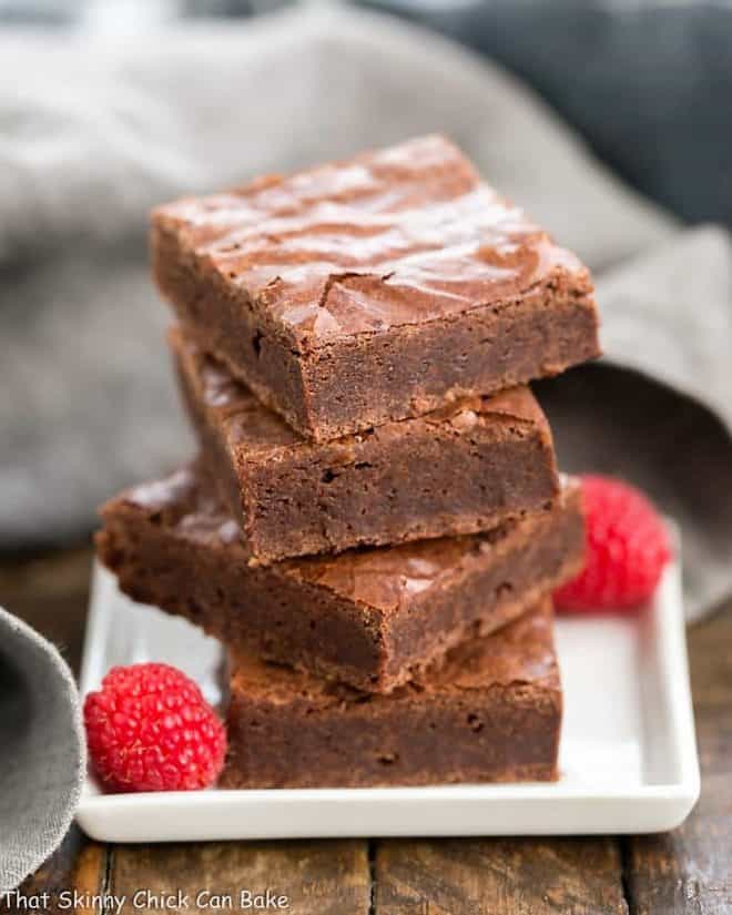 Best Fudgy Brownies stacked on a white square plate