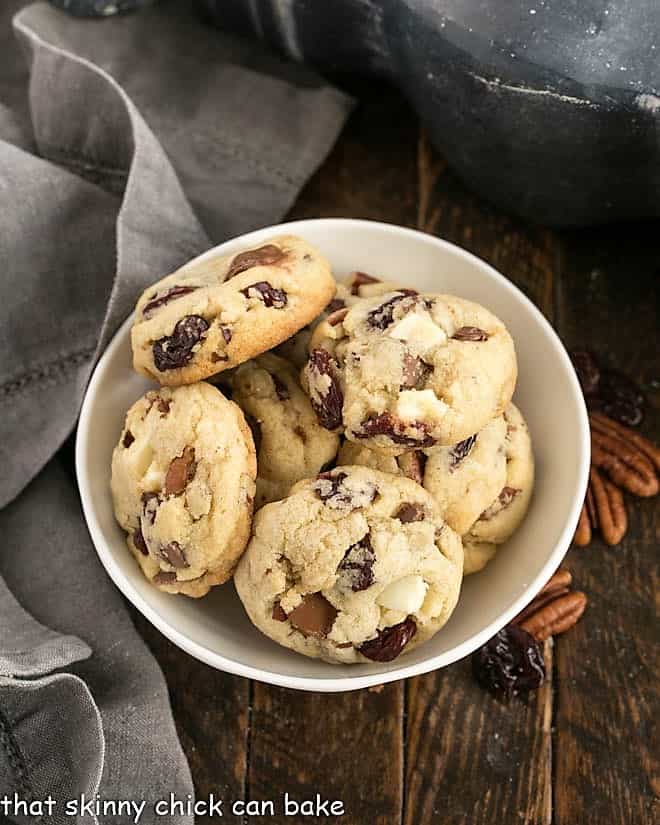 Overhead view of a small bowl full of chocolate chunk cookies