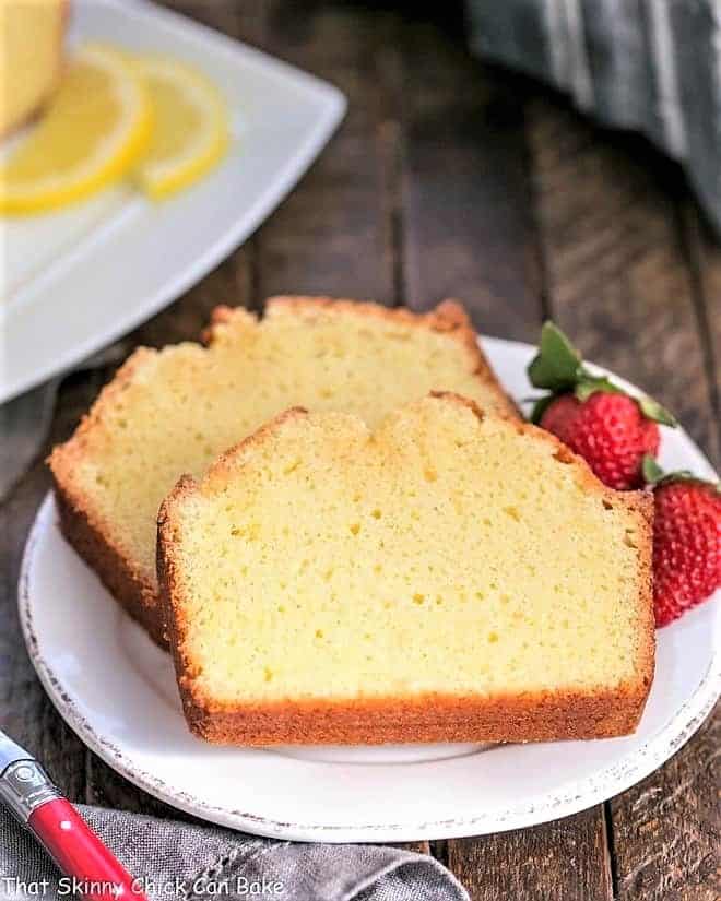 Glazed Lemon Pound Cake slices garnished with berries