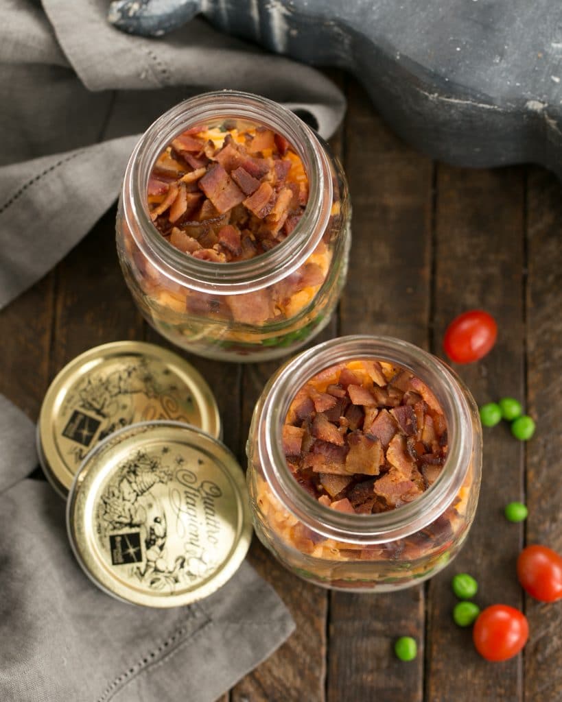 Overhead view of 2 Make Ahead 7-Layer Salads in a Jar 