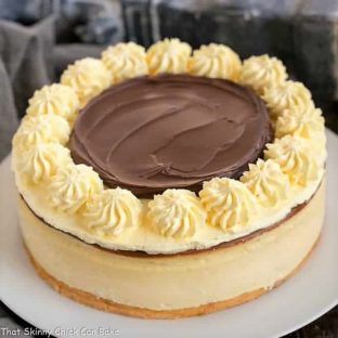 Boston Cream Pie Cheesecake on a white serving plate