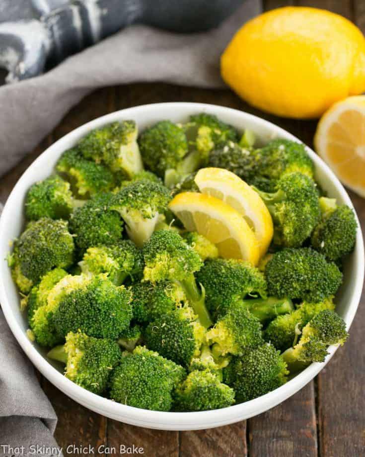 A bowl of food with broccoli, with Garlic and Lemon