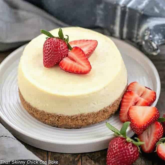 Vanilla Bean Instant Pot Cheesecake on a white plate.