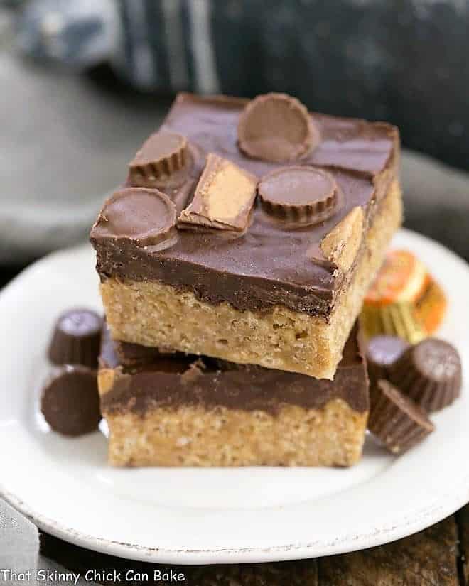  A stack of Reeses Rice Krispie Treats on a small white ceramic plate