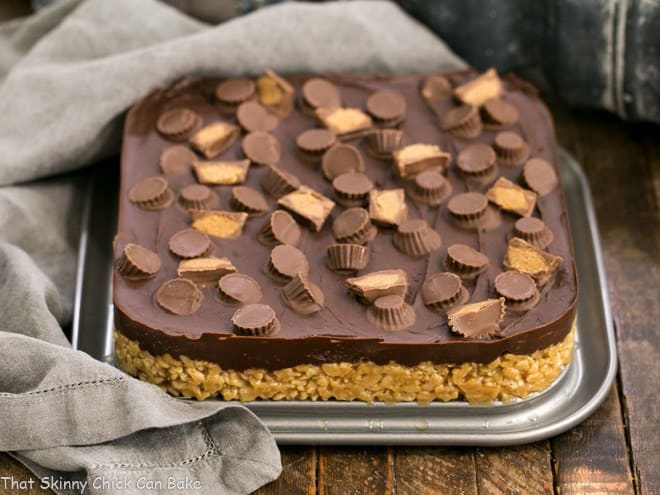 Reeses Rice Krispie Treats in the bottom of a square springform pan.