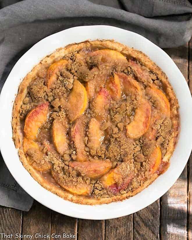 Overhead view of an Easy Peach Crumb Pie in a white pie plate.