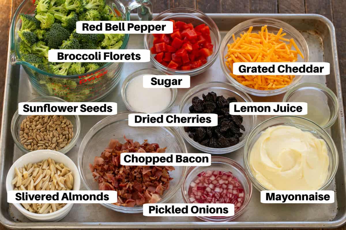 Broccoli Salad Ingredients with labels on a metal sheet pan.