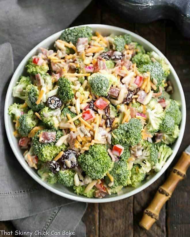 Overhead shot of Broccoli Salad with Bacon and Dried Cherries in a white serving bowl.