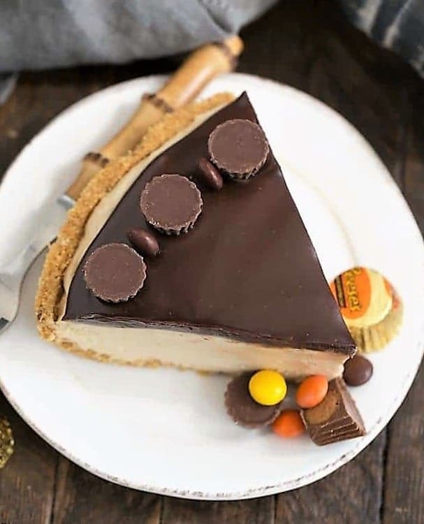 Overhead view of a slice of Frozen Chocolate Peanut Butter Pie on a white plate.