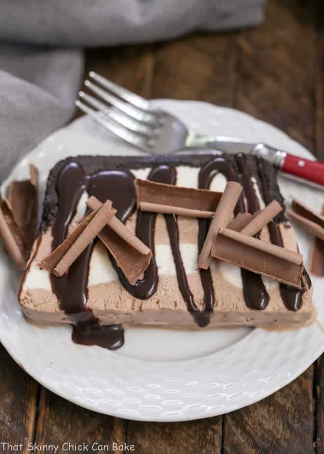 No-Churn Ice Cream Cake slice on a white plate with a red handled fork