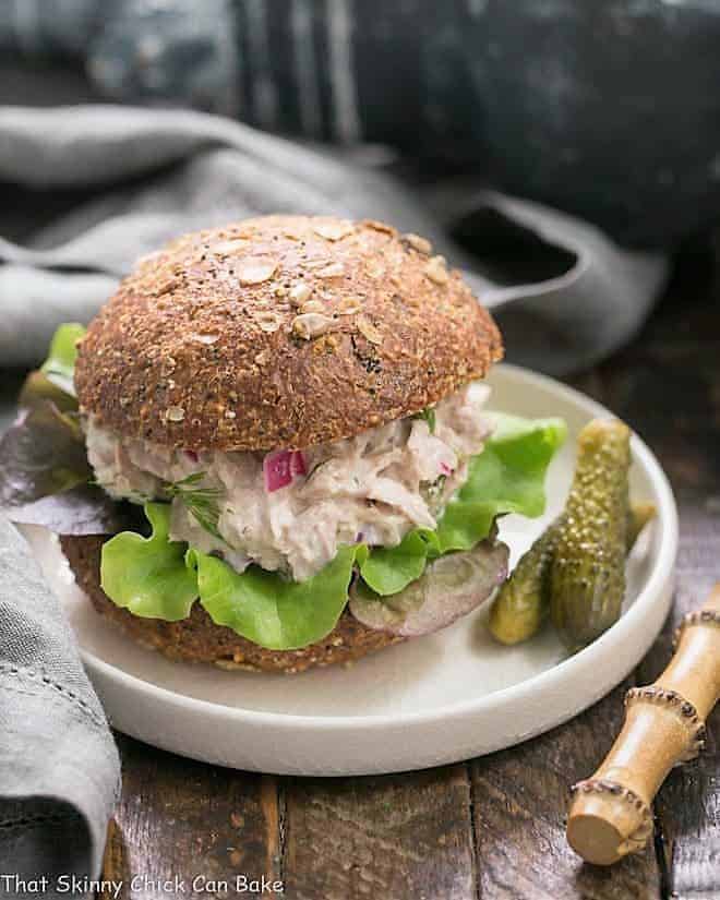 Easy Tuna Salad with Fresh Dill - a simple way to shake up your tuna salad with herbs, pickled onion and a squeeze of lemon Easy Tuna Salad with Fresh Dill on a white plate with cornichons.