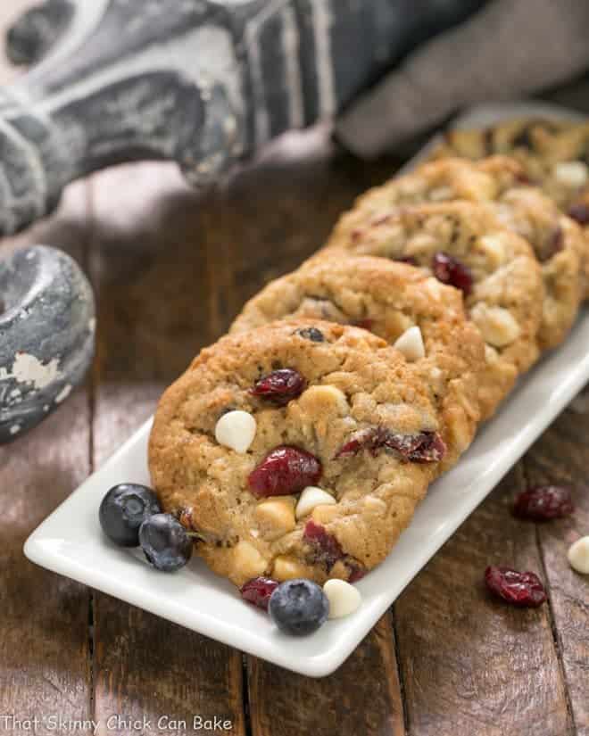 White Chocolate Chip Cookies with Dried Berries on a white rectangular tray