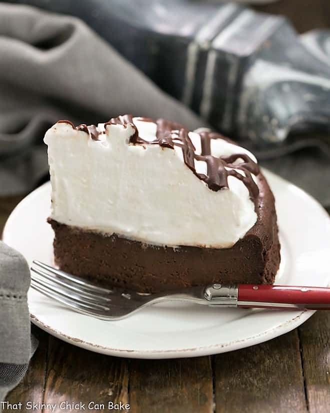 Flourless Chocolate Cake with Marshmallow Frosting - a dense dreamy chocolate cake topped with a mound of sweet, fluffy marshmallow frosting!