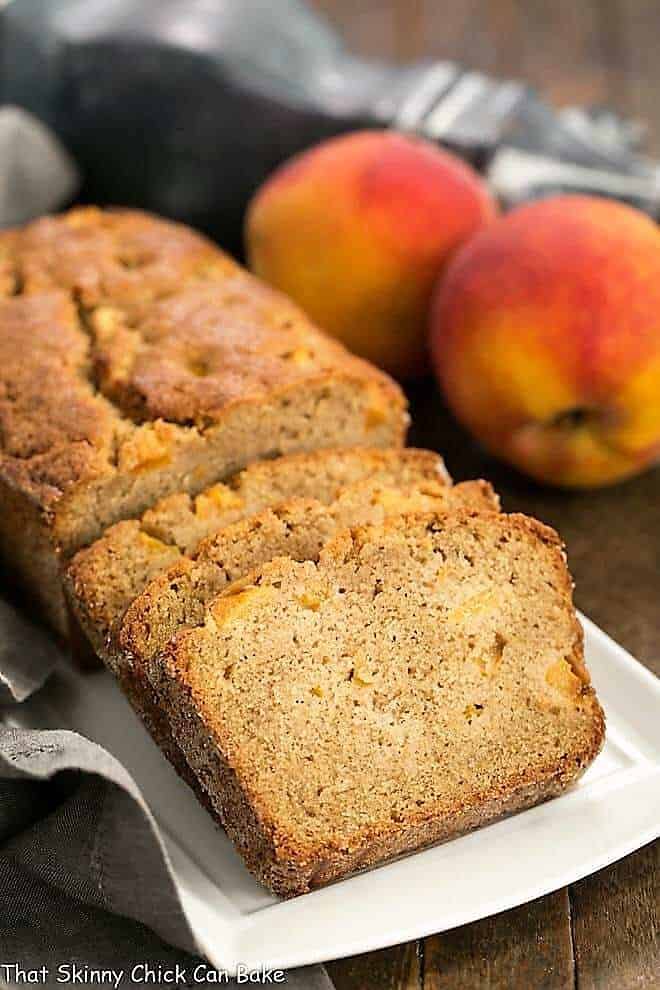 Fresh Southern Peach Soda Bread sliced on a white rectangular tray.