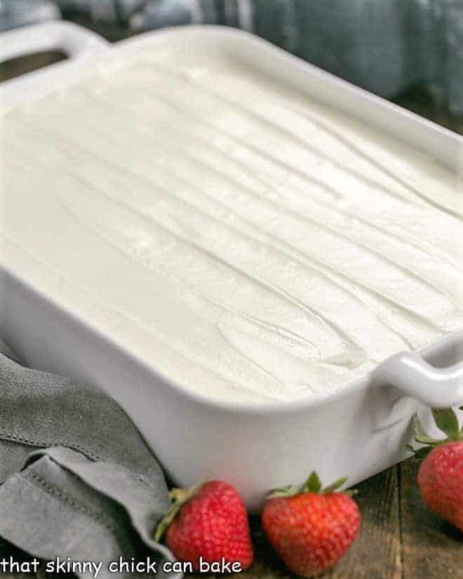 Authentic Tres Leches Cake in a ceramic 9 x 13 pan.