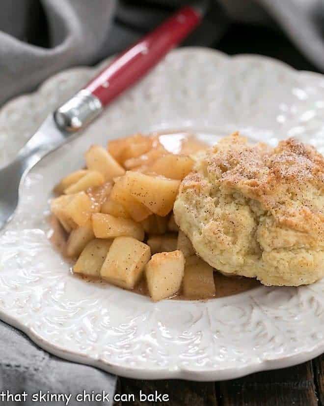 Apple Cobbler on a white plate with a red handled fork