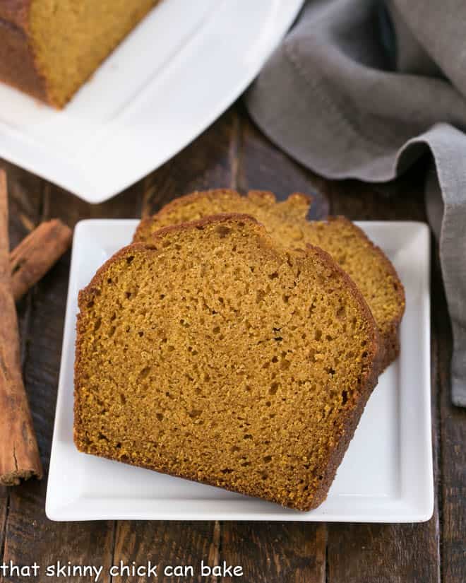 Classic Pumpkin Bread slice on a square white plate.