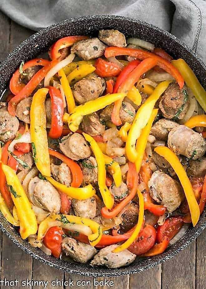 Italian Sausage and Peppers in a black skillet