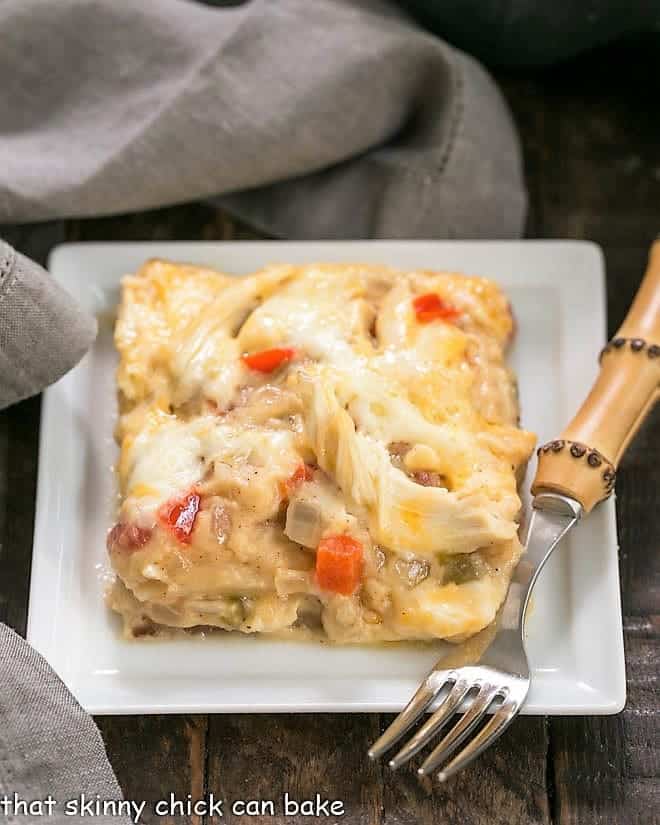 King Ranch Casserole from Scratch on a white plate with a bamboo handled fork.