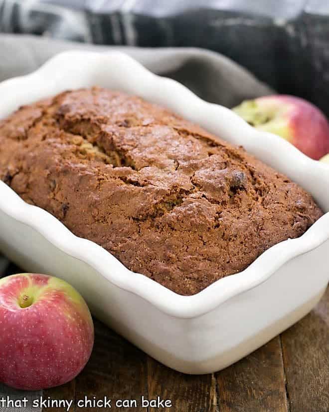 Sliced Glazed Cranberry Apple Bread in a white loaf pan