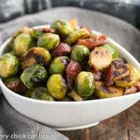 Maple Syrup Mustard Glazed Brussels Sprouts in a tear shaped bowl