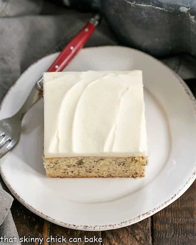 Sour Cream Banana Cake on a round white plate from above.